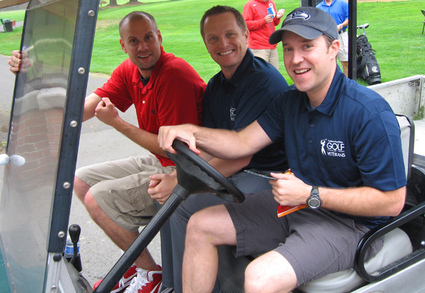 CFD golf tourney - golfers in cart