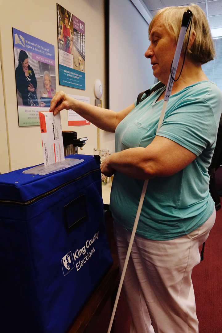 Marci Carpenter votes her Primary ballot after using an Accessible Voting Unit. 