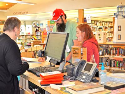 Jenny Grenfell assists library patrons