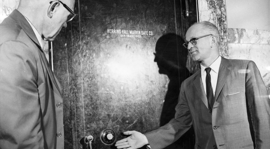 Secretary of State Vic Meyers inspects the safe