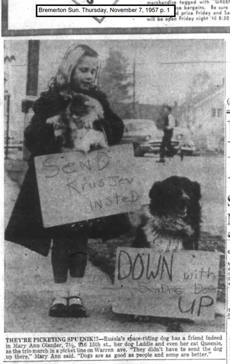 Mary Ann Olander, 7 1/2, with her dog, Laddie, and cat, Queenie, picketing against the Sputnik 2 rocket.