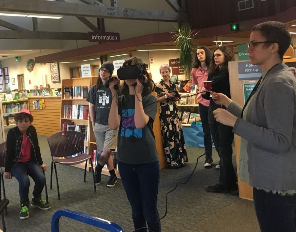 Teens experience virtual reality (VR) during a public-library event made possible by Washington State Library’s VR in Libraries project (Photo: Washington State Library).