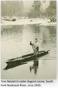 Tom_Nesset_in_cedar_dugout_canoe_South_Fork_Nooksack_River_circa_1920