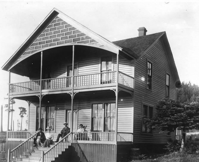 Photo of the Crook house with family on the porch from Jim Crook House, San Juan Island.