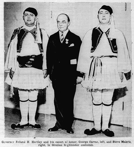 Three men two in traditional Greek costumes